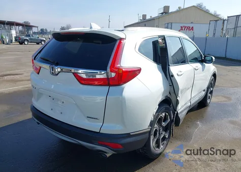 2017 Honda Cr-V Touring z USA, uszkodzony, nr VIN 2HKRW1H9XHH515567
